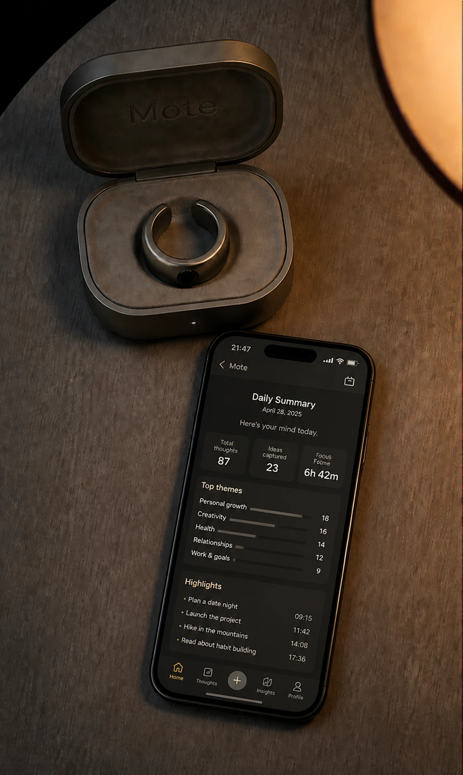 The Mote charging case open beside a phone showing the evening daily summary