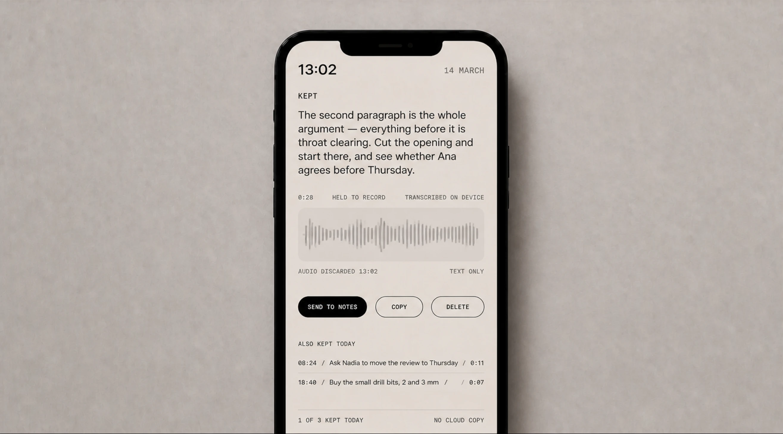 A phone showing a thought transcribed from a single press of the cuff