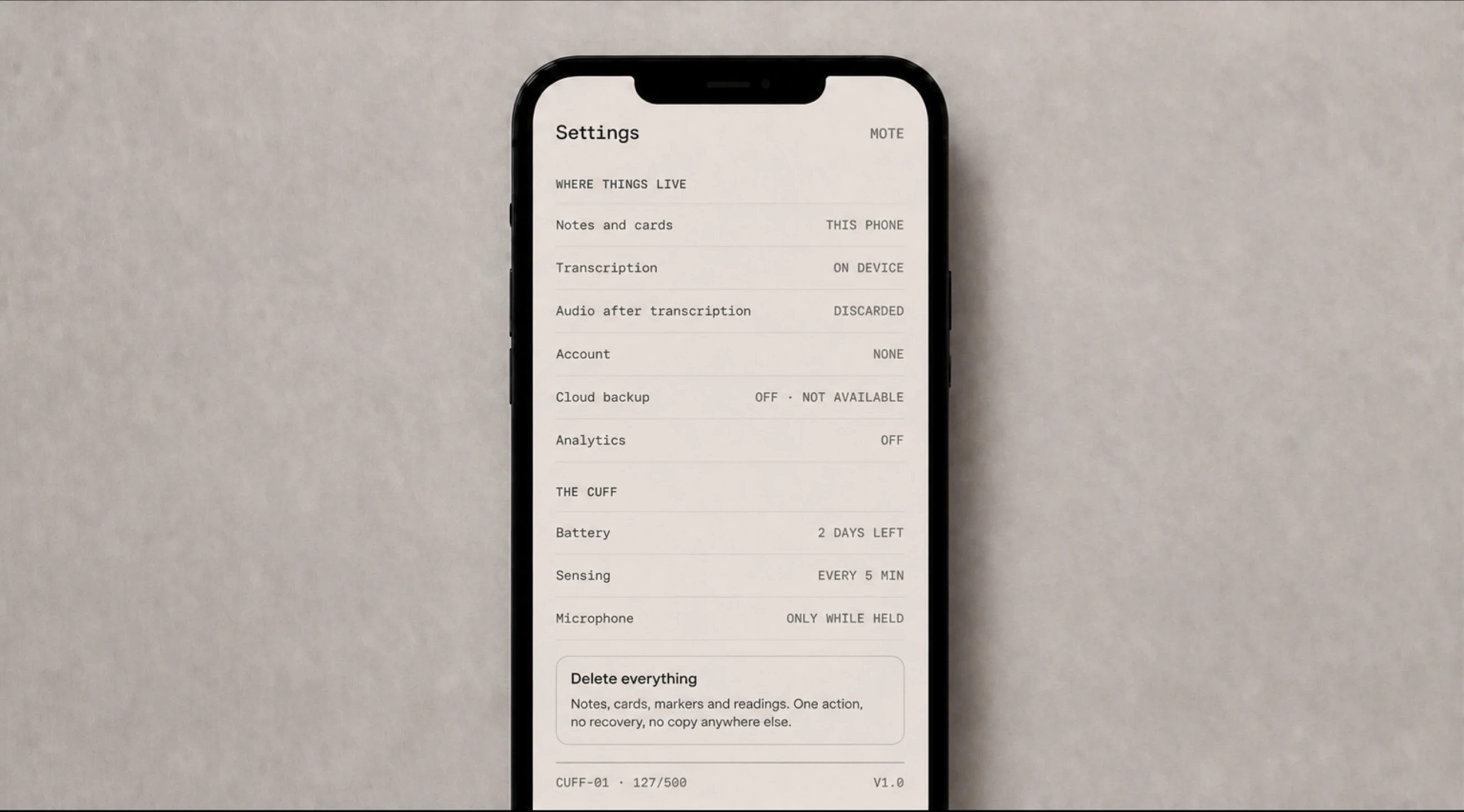 A phone showing Mote settings, with notes and cards kept on the device